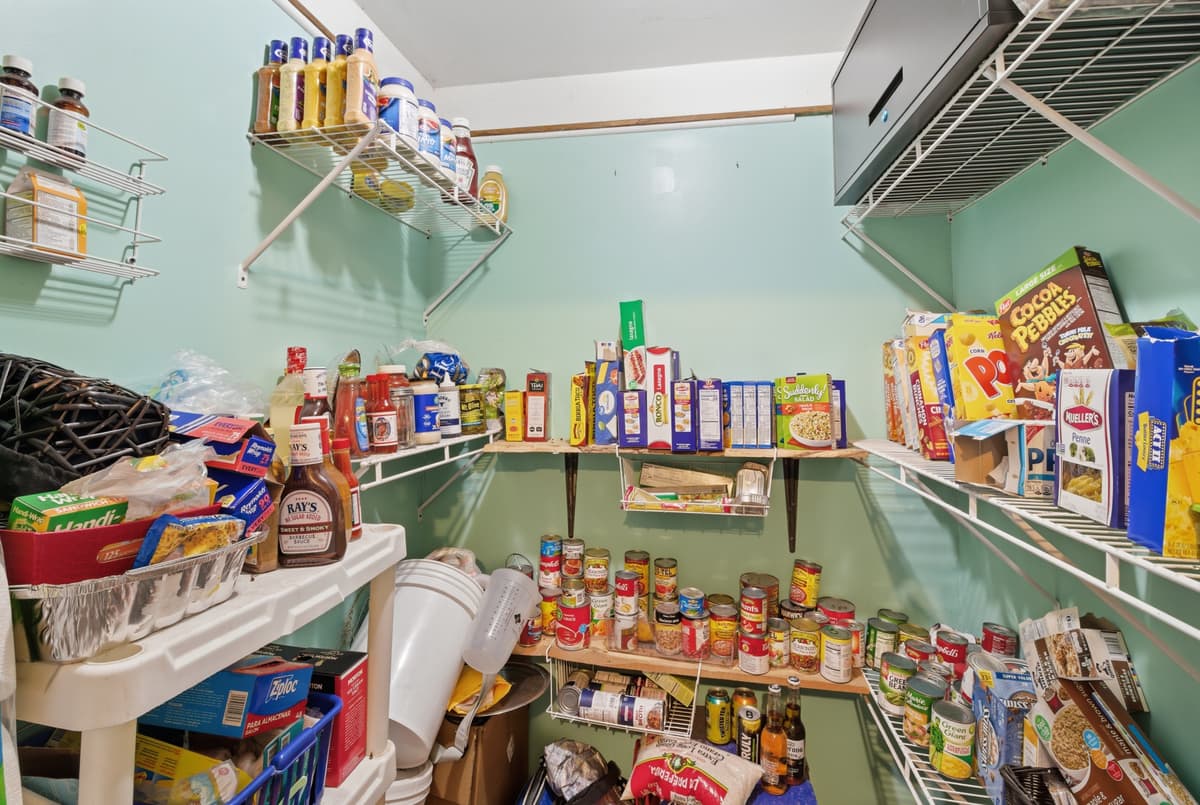 Cluttered pantry before real estate photography home staging